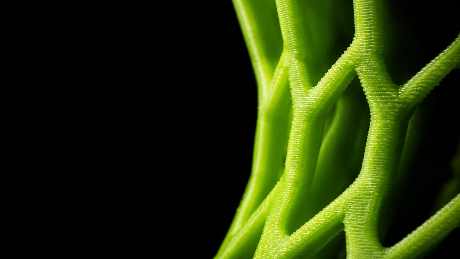 Detalhe macro das camadas de uma peça impressa em filamento verde